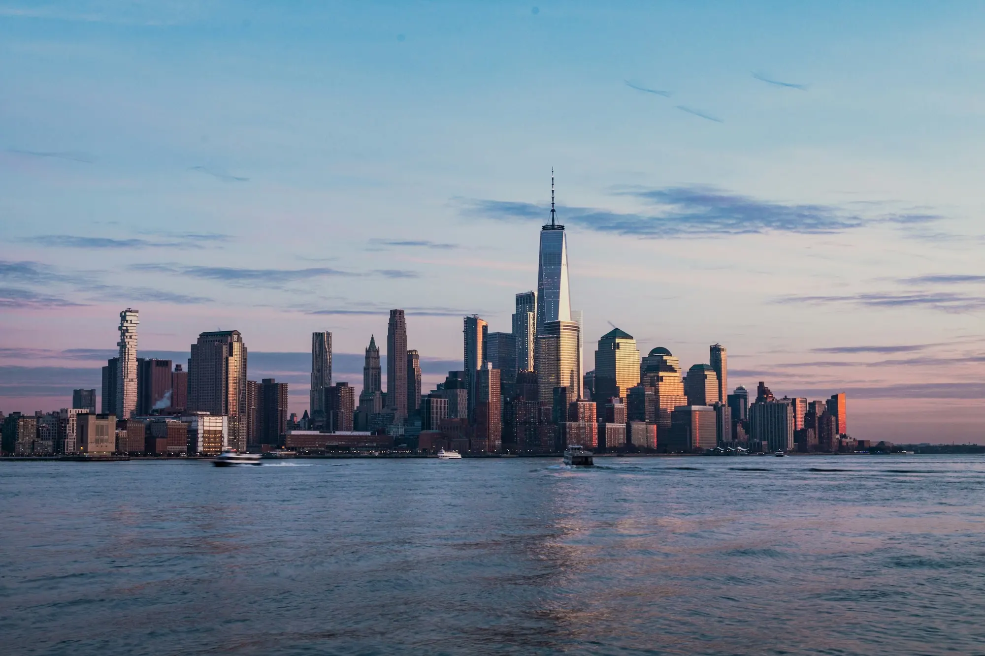 The Manhattan skyline across the Hudson River at dusk