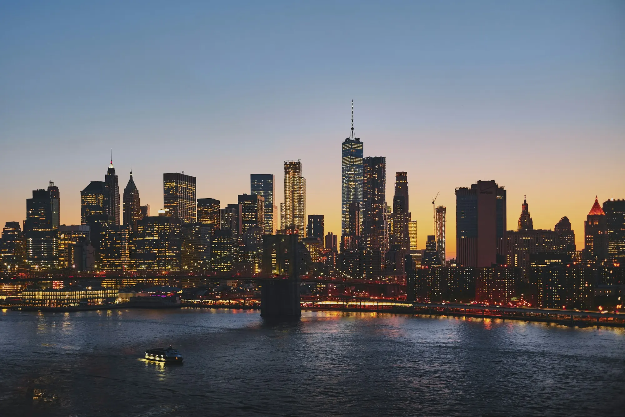 The New York skyline at dusk under a coloured sky
